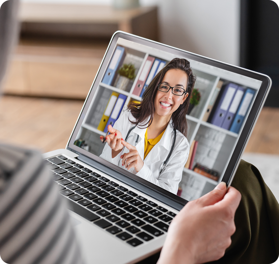 Video call with a female doctor on laptop.